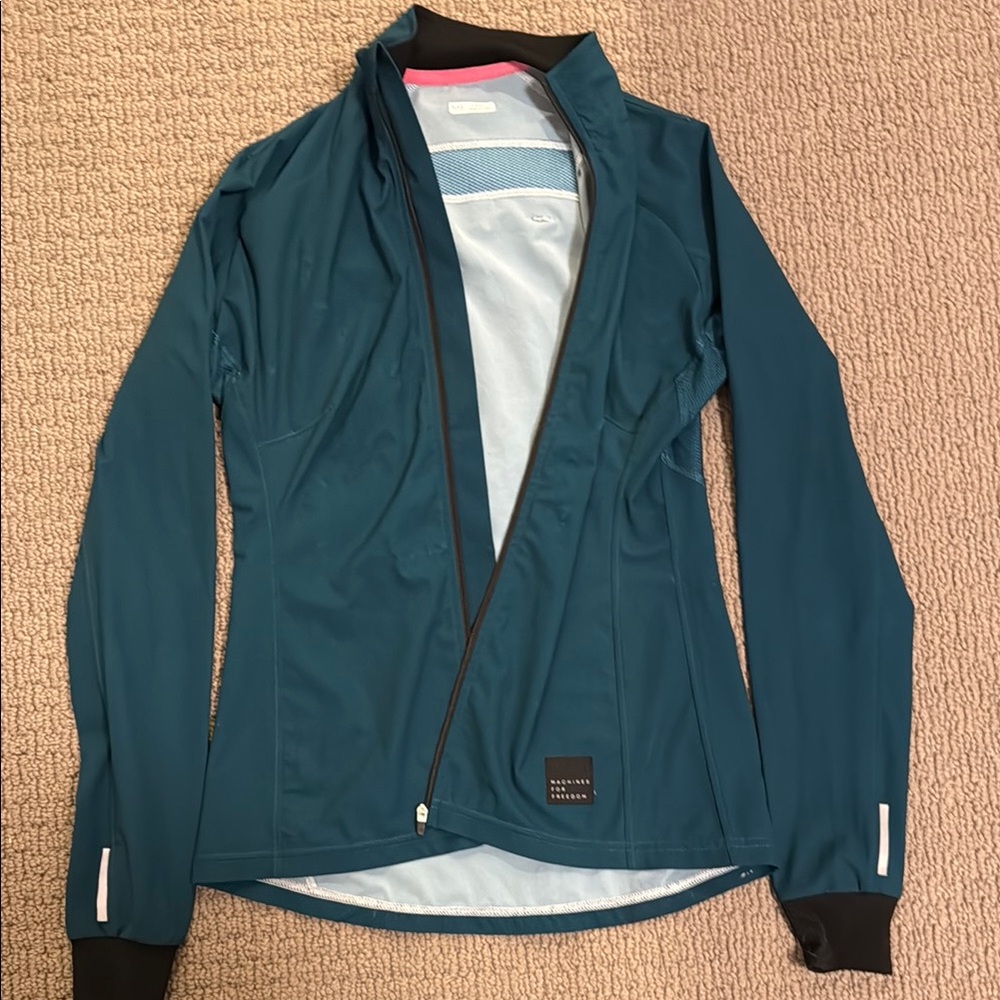 Teal machines for freedom cycling Jacket